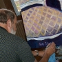 Signing a Painting