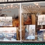 Paintings in Window of Lakeshore Gallery